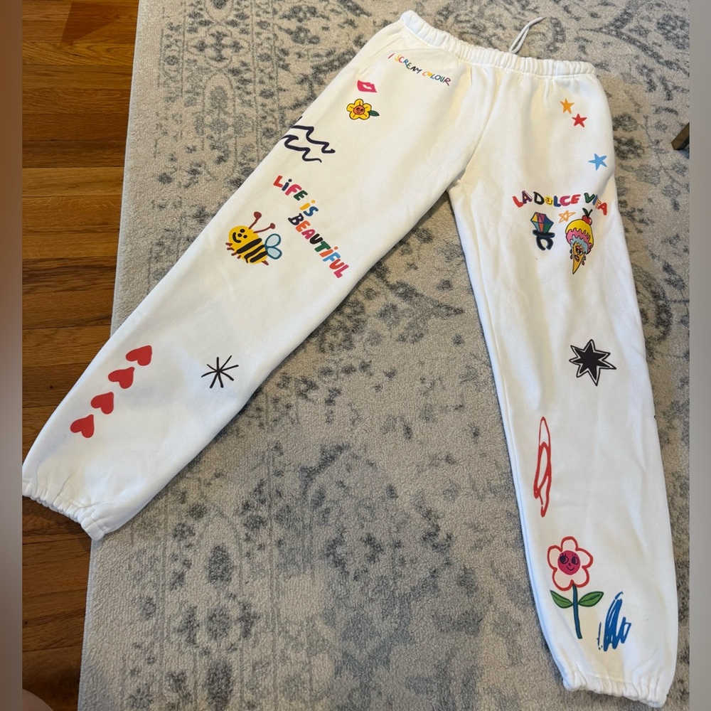 Gently used, graphic sweatpants from The Mayfair Group.